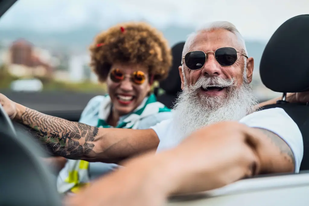 Happy senior couple having fun driving