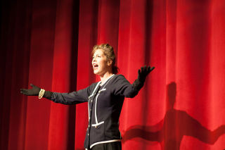 woman on stage performing an act