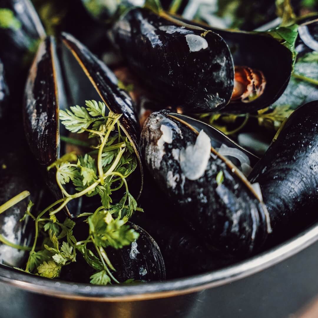 A bowl with mussels served at The Social Bar & Bistro. 