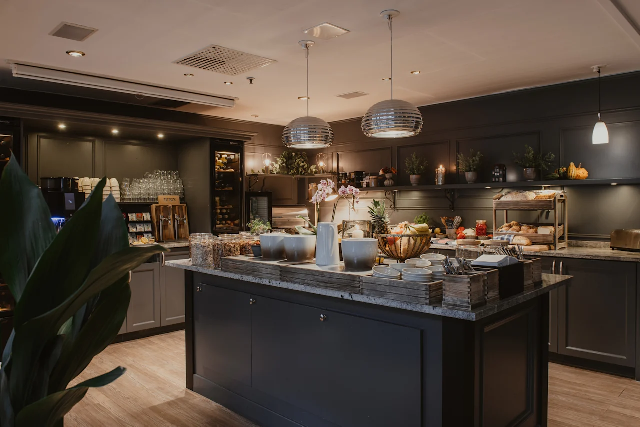 A delightful breakfast spread at Home Hotel Kung Oscar, with a variety of fresh food and drinks laid out for guests.