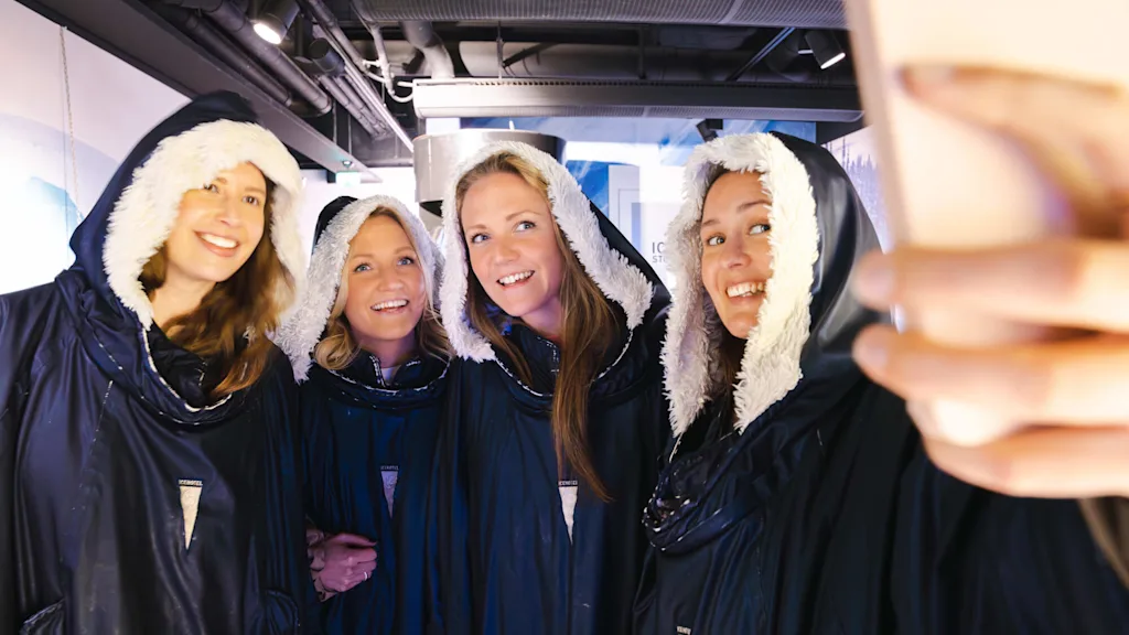 Friends taking a picture together at ICEBAR in Stockholm.