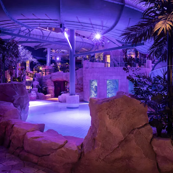 People enjoying the water park at Quality Hotel The Reef in Fredrikshavn, a fun and refreshing experience.