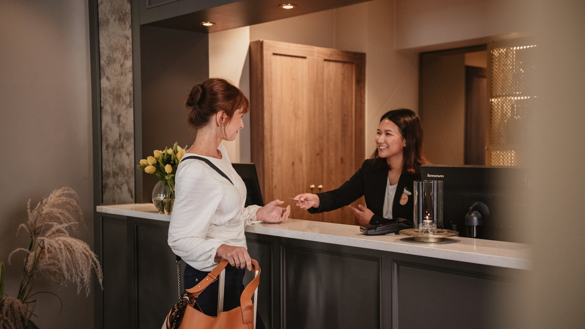 Home Hotel woman checking in