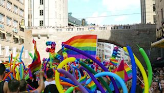 Stockholm Pride - people & colorful balloons At the Pride Parade