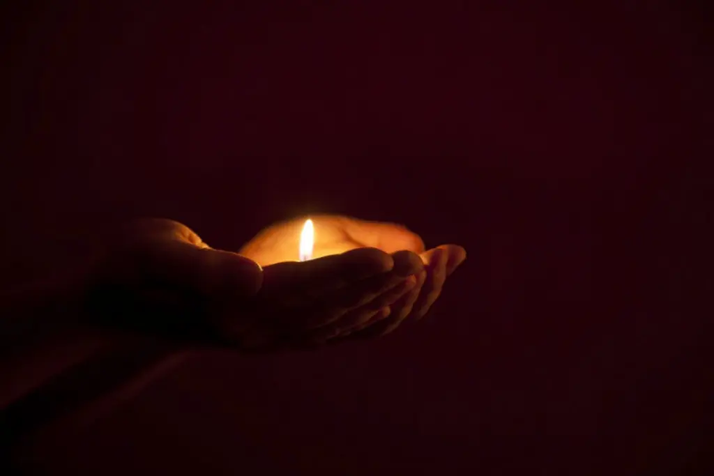 Candle in hands