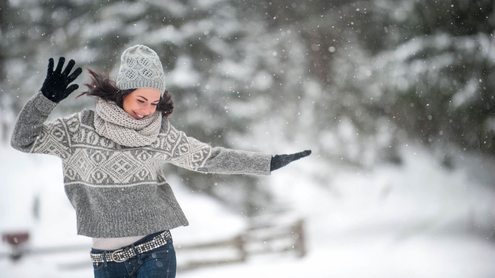 Woman dancing in snow