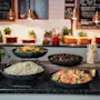 A vibrant buffet spread with fresh salads and dressings. Chalkboards in the background read SNALLA TANK PA MATSUNNET and Appetit.