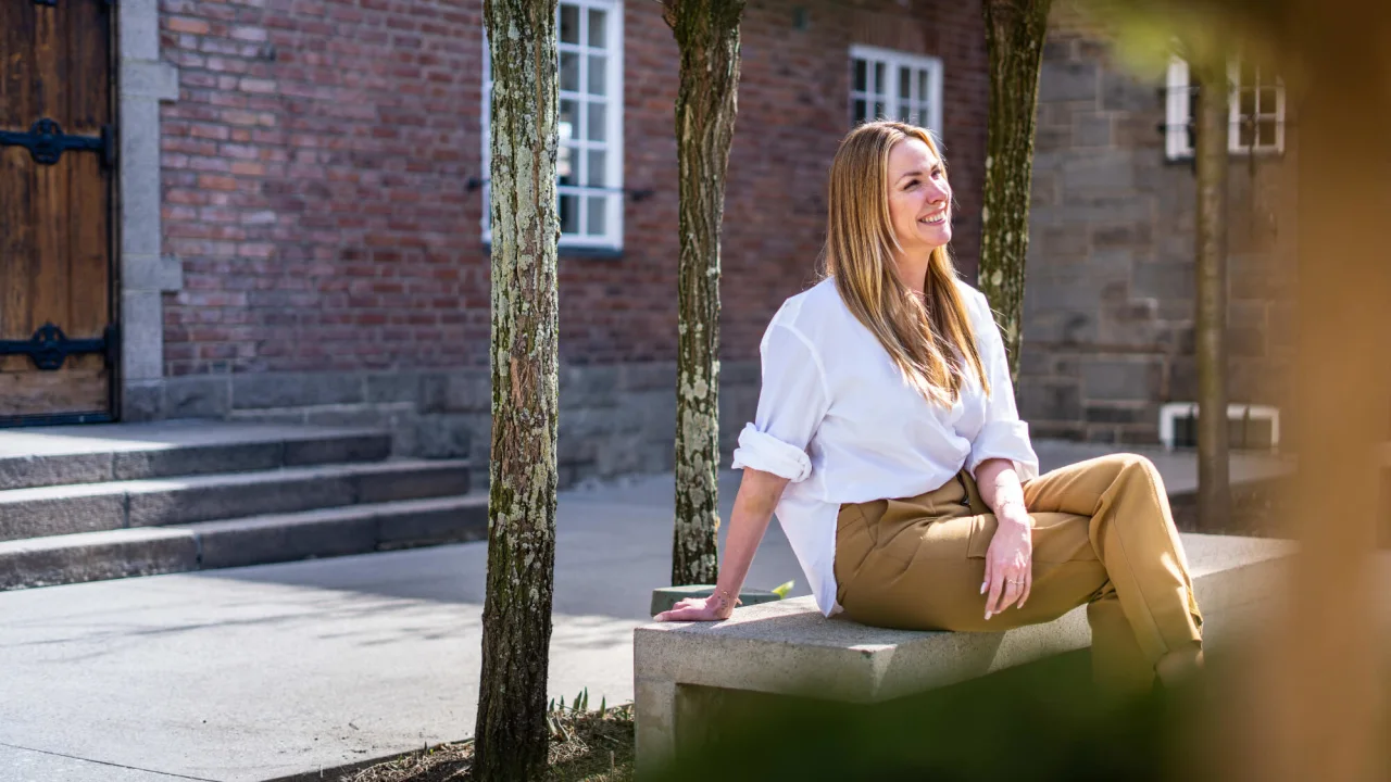 Girl sitting on a bench.