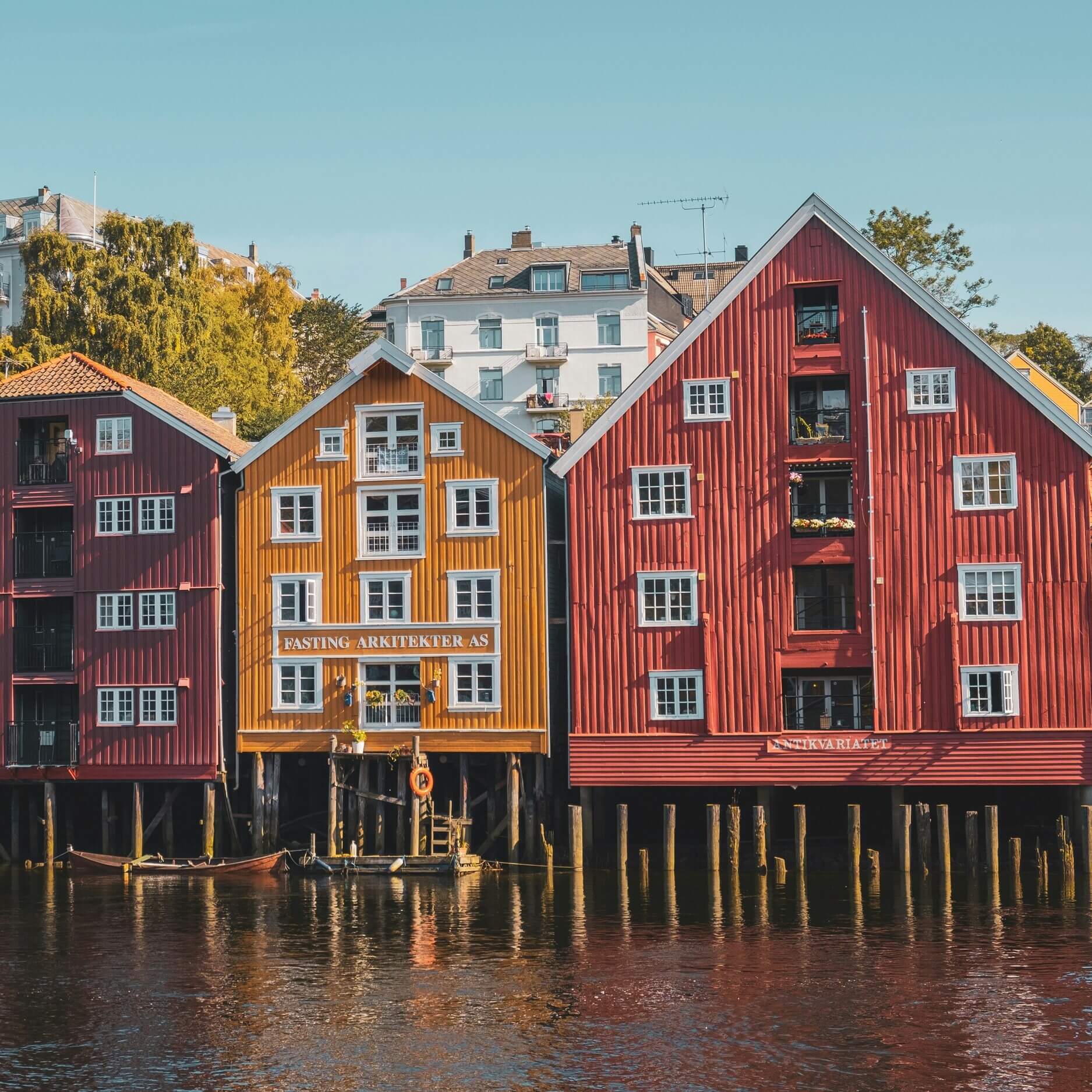 Historic colourful wooden houses in Trondheim by Nidelva river. 