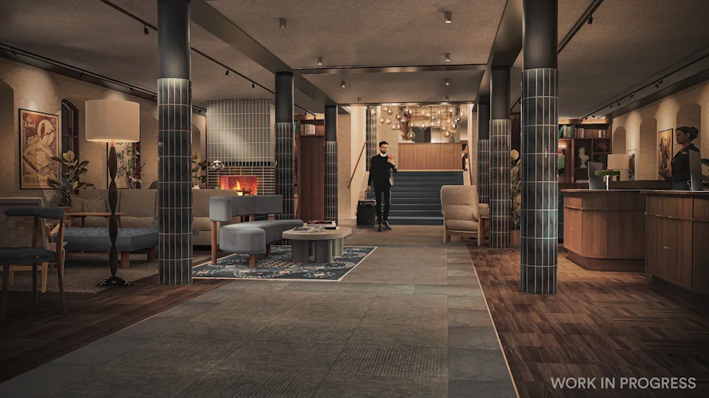 Hotel lobby with a guest arriving, a reception desk, and a cozy lounge area with a fireplace. 