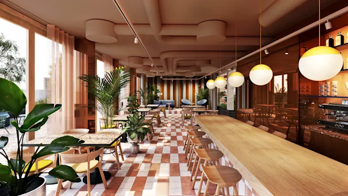 Cafe with wooden furniture and green plants, featuring a long counter and round pendant lights; sunlight streams through large windows, illuminating the tiled floor in a cozy, modern setting.