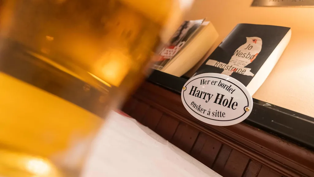 A sign of where the fictional character Harry Hole likes to sit at the restaurant.