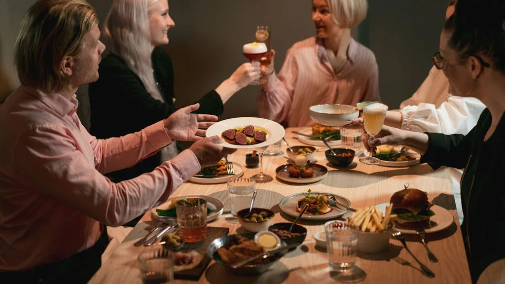 people toasting in restaurant