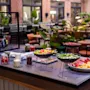 A vibrant breakfast buffet at Comfort Hotel Vesterbro, featuring fresh fruits, vegetables, and other delicious morning selections.