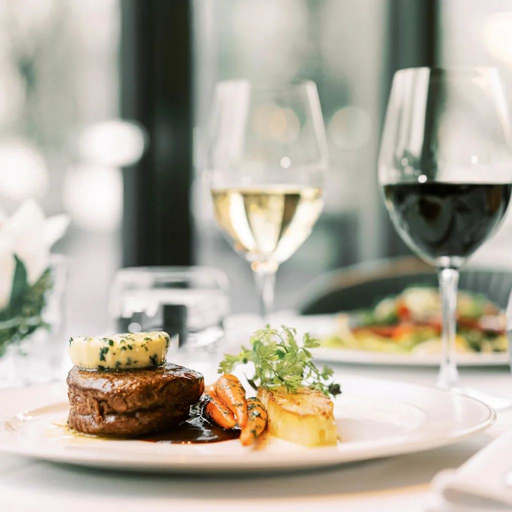Food and wine at restaurant Brasserie Kämp in Helsinki.