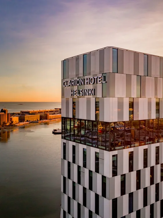 Facade of Clarion Hotel Helsinki in sunset in Helsinki.