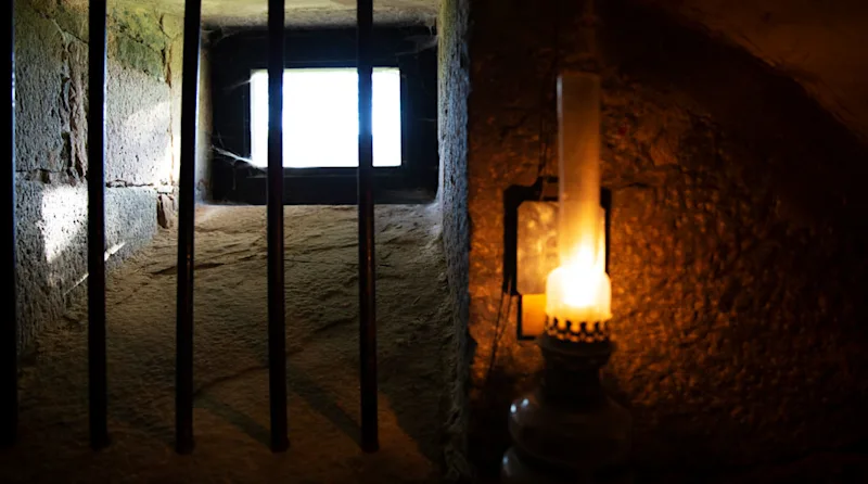 An old prison cell at the museum at Home Hotel Bilan