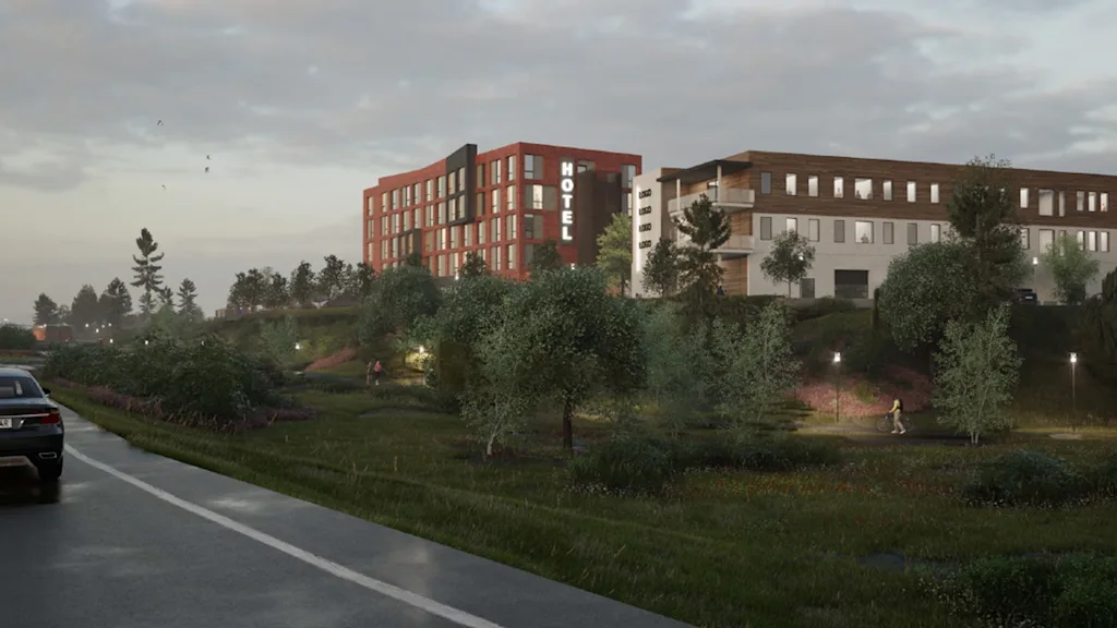 En moderne hotelbygning med et HOTEL-skilt, set fra en vej. Folk går og cykler i et grønt parkområde.