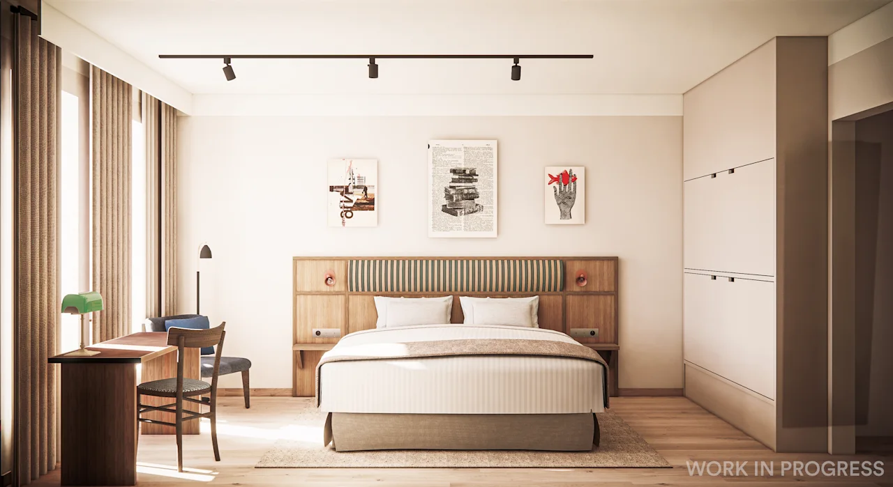 A modern hotel room with a bed, a desk, and artwork on the wall. Natural light fills the space. 