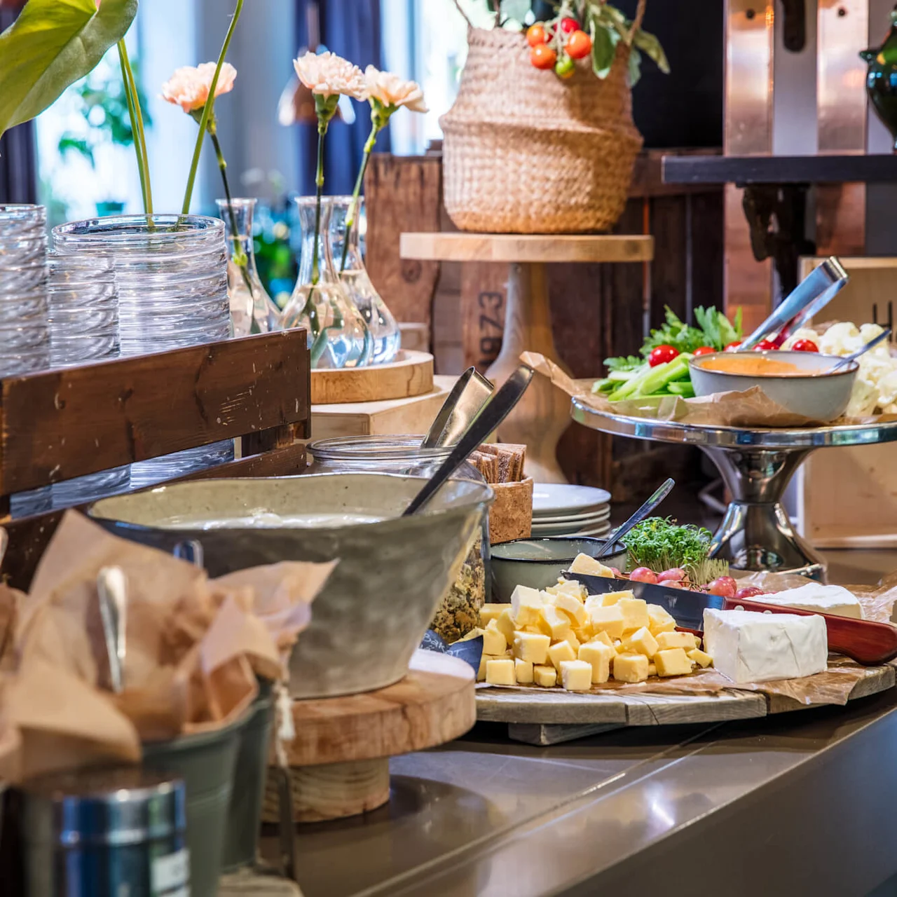 Buffet table with various dishes and utensils, a sign reads "Have a nice STAY!"
