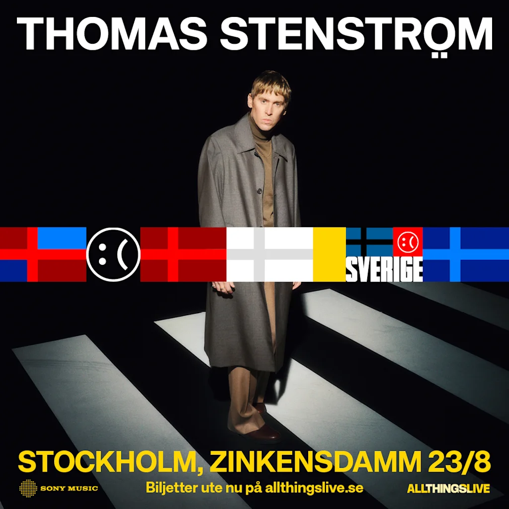 A person in a coat stands on a zebra crossing, surrounded by various flags. Text: "THOMAS STENSTRÖM," "SVERIGE," "STOCKHOLM 23/8 ZINKENSDAMM."
