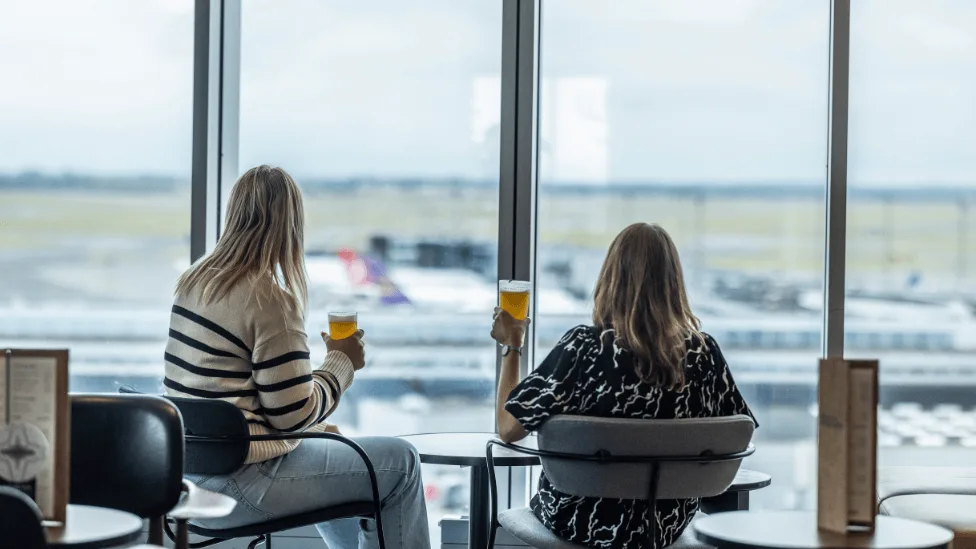 Two girls watching the view at The Viewpoint at Comfort Hotel Copenhagen Airport.