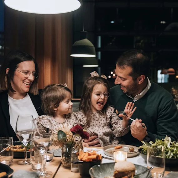 A family having dinner at Quality Hotel™.