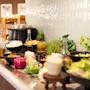 A vibrant buffet spread featuring a variety of fresh salad ingredients, dressings, and other delicious food options.