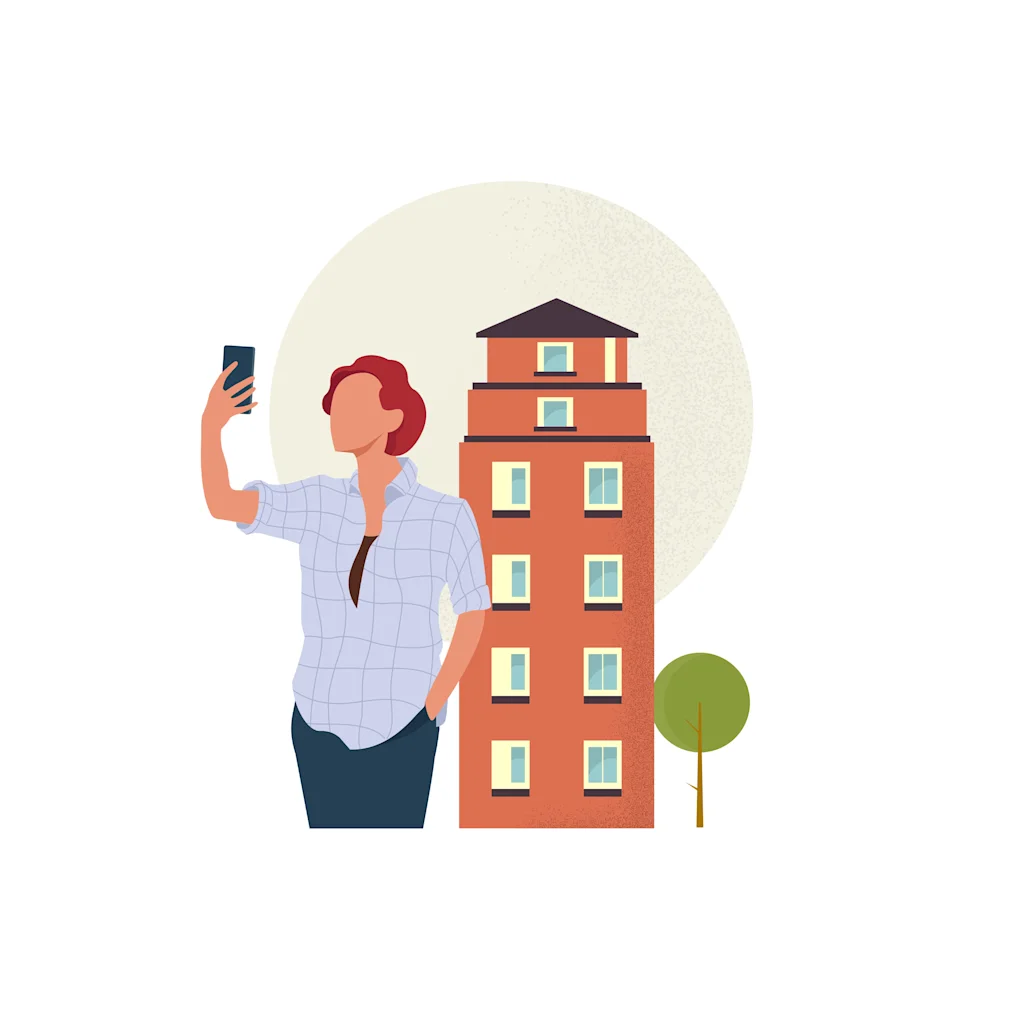 En person tar en selfie med en smarttelefon foran en høy bygning og et lite tre.