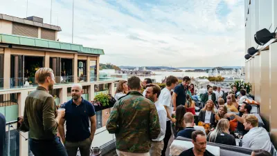 People at rooftop bar at Calmayers Hage with view over Oslofjorden, Clarion Hotel Oslo.