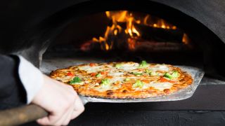 stock-pizza-in-stone-oven