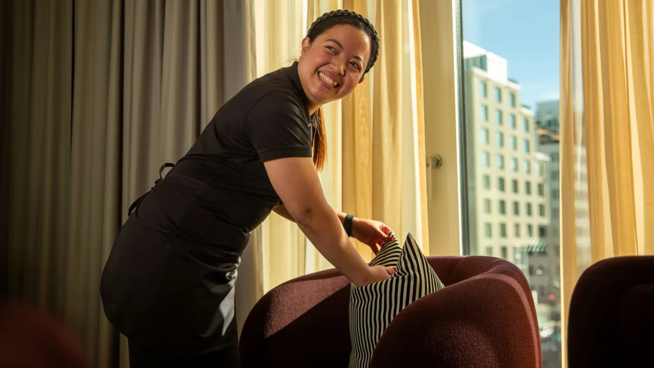 Sheila cleans a hotel room at Clarion Hotel The Hub