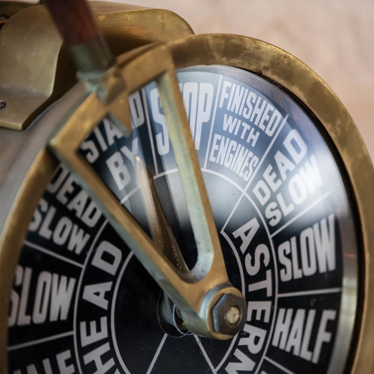 A ship's telegraph with visible commands like "STOP," "DEAD SLOW," and "FINISHED WITH ENGINES."