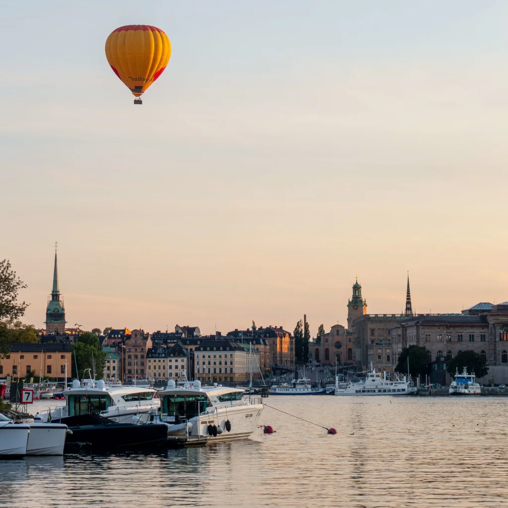 Hot air balloon a sunny evening over Mälaren in Stockholm city.