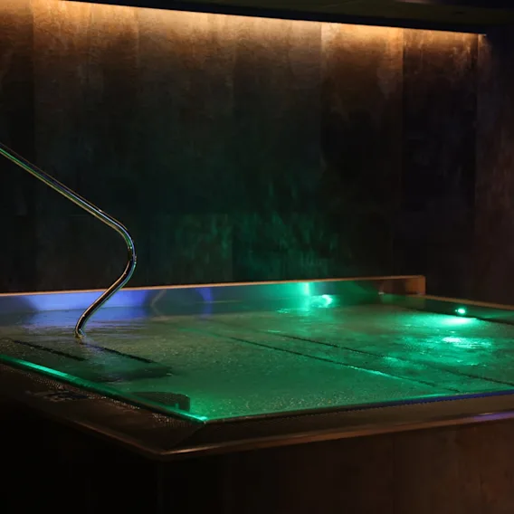 Warm pool in a green light at Obie Spa at Clarion Hotel Draken in Gothenburg.