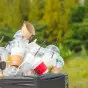 Plastic cups in rubbish bin