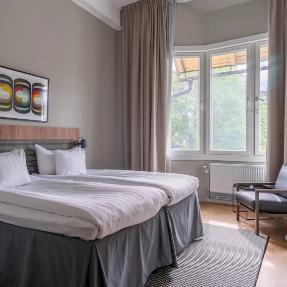 A bed in a hotel room at Quality Hotel Park Södertälje