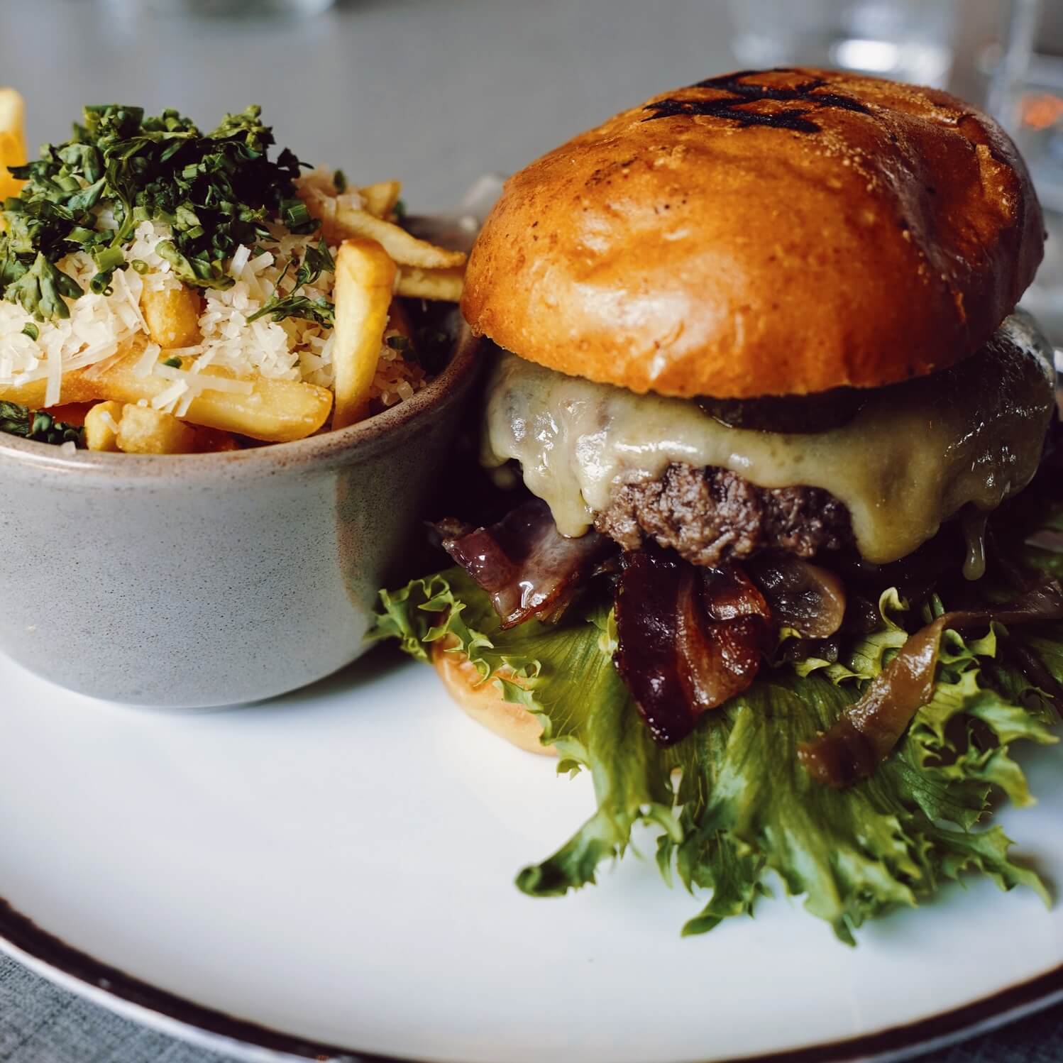 Hamburger and fries at restaurant The Social Bar & Bistro.