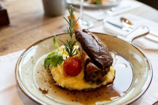 lamb-shank-served-on-plate-with-potato-mash