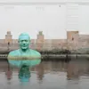 Copper statue in water in Borås.