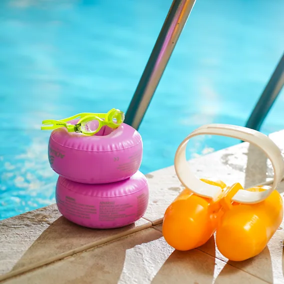 Colorful children swimming gear by the poolside at Clarion Hotel Winn.