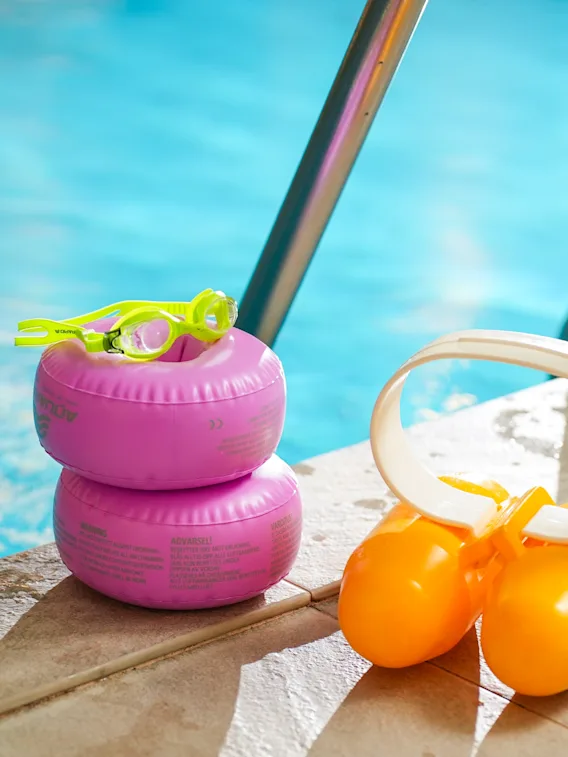 Colorful children swimming gear by the poolside at Clarion Hotel Winn.