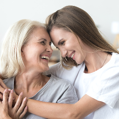 Mother and daughter hugging each other
