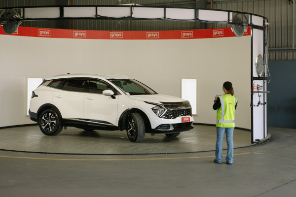 Grays staff photographing a car
