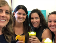 A group of Embrace employees enjoying happy hour at the office