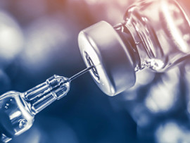 vaccine-bottle-and-needle