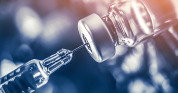 vaccine-bottle-and-needle
