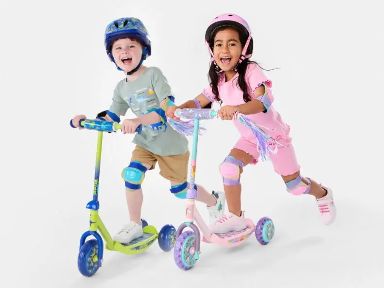Boy & girl talent riding scooters