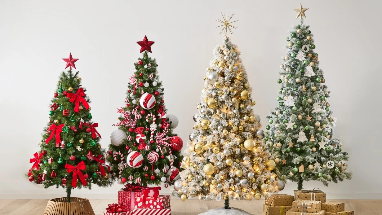 Four Christmas trees decorated and inspired by each of the festive themes