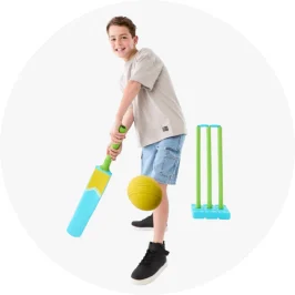 Boy Playing With Beach Cricket